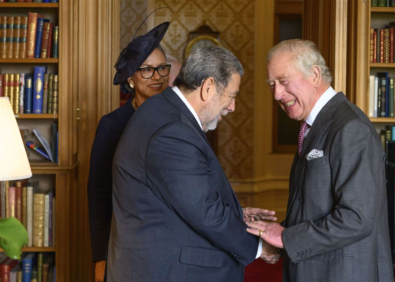 King Charles III greets the Prime Minister of St Vincent and the Grenadines, Ralph Gonsalves, and Mrs Eloise Gonsalves, at Balmoral in Scotland (John Linton/PA)