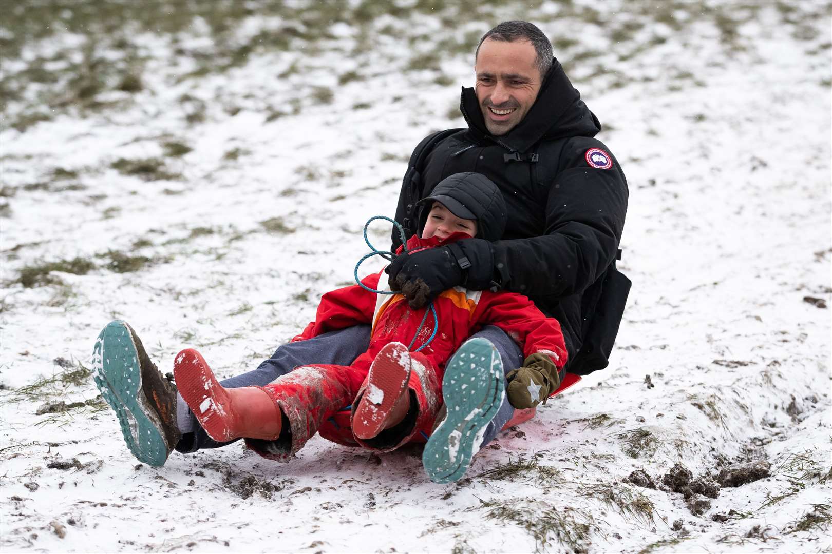 Sledging fun on Primrose Hill in London (Aaron Chown/PA)