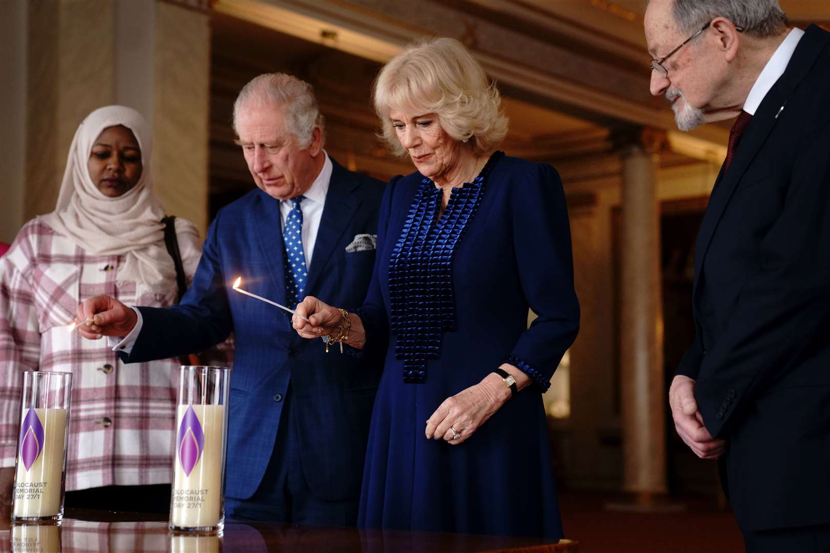 The King and Queen light candles at Buckingham Palace to mark Holocaust Memorial Day on January 27 2023 (Victoria Jones/PA)