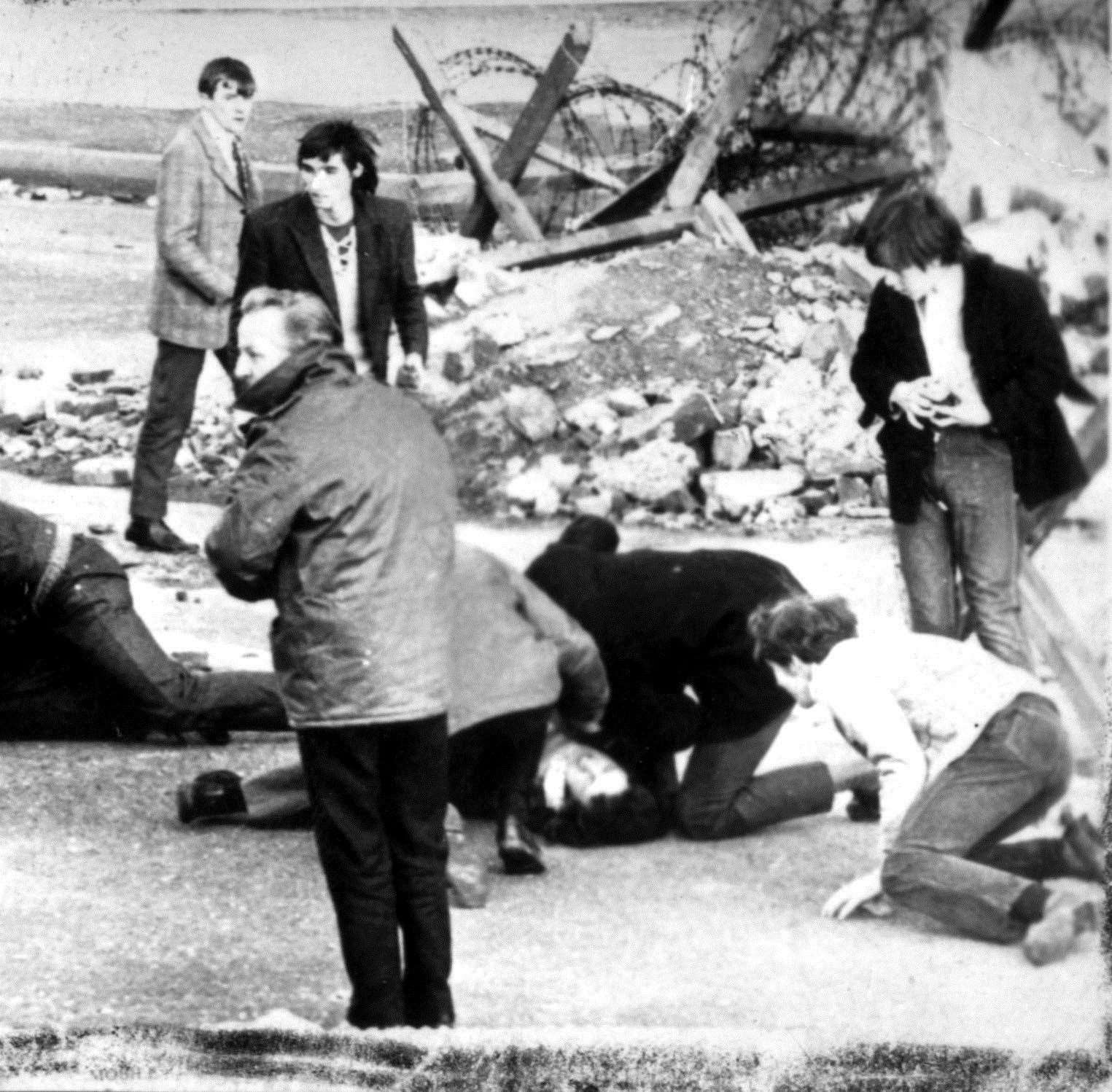 A man receiving attention during Bloody Sunday (PA)