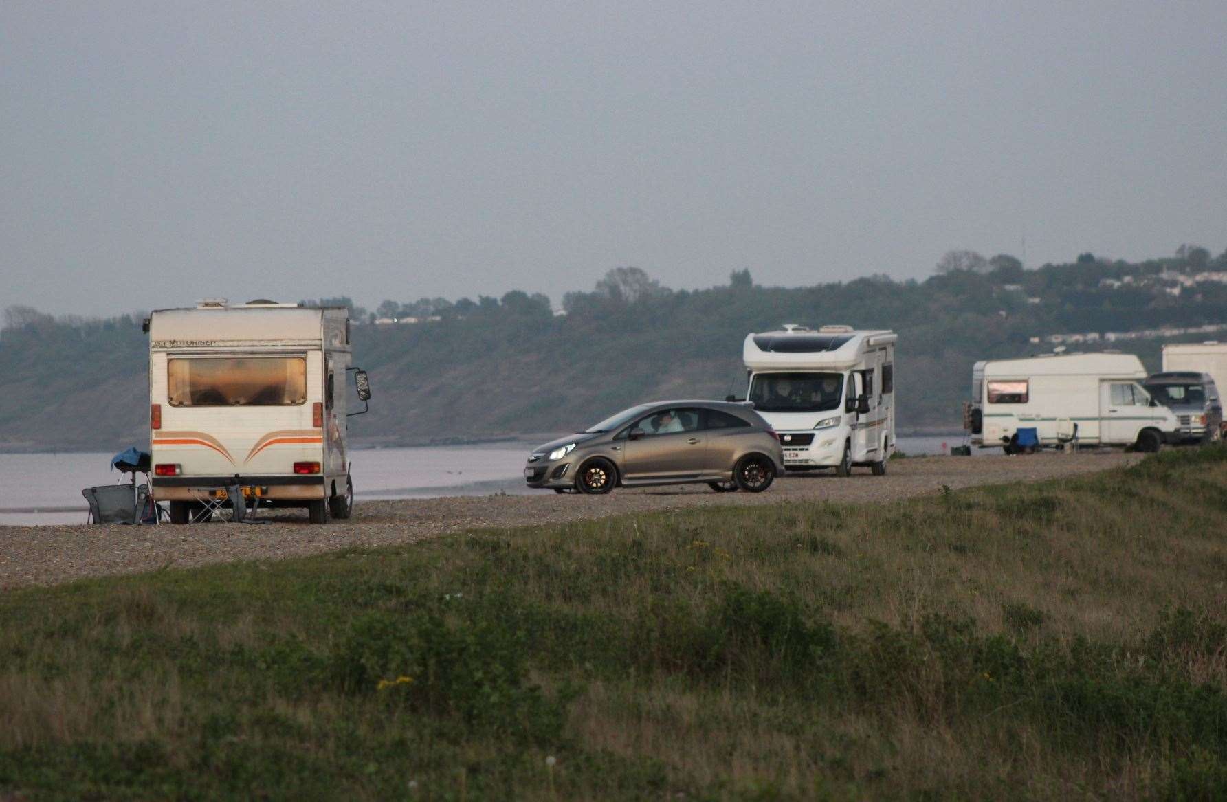 Cars and motorhomes parked on the Shingle Bank in Minster, Sheppey