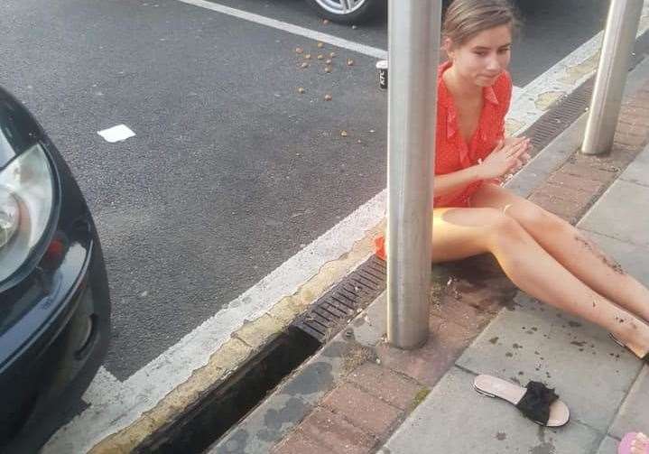 Aleksandra sat on the side of the road in shock with her KFC strewn across the car park (13351536)