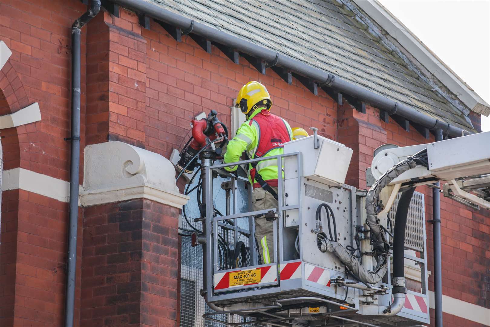 Merseyside Fire & Rescue service help repair a broken window at Southport Islamic Centre Mosque (James Speakman/PA)