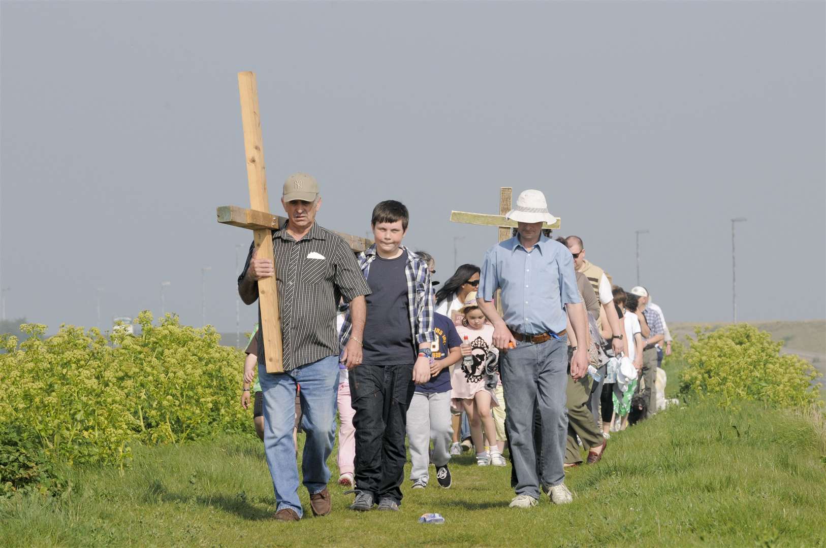 The cross from St Henry and Elizabeth, is walked to the site of the annual service in Minster