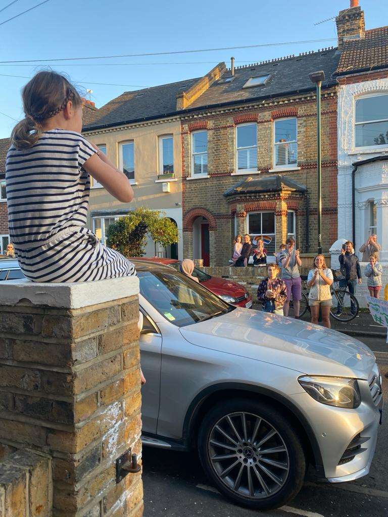 Mr Clark’s neighbours clapped him from the street after he finished his triathlon (Neil Clark/PA)