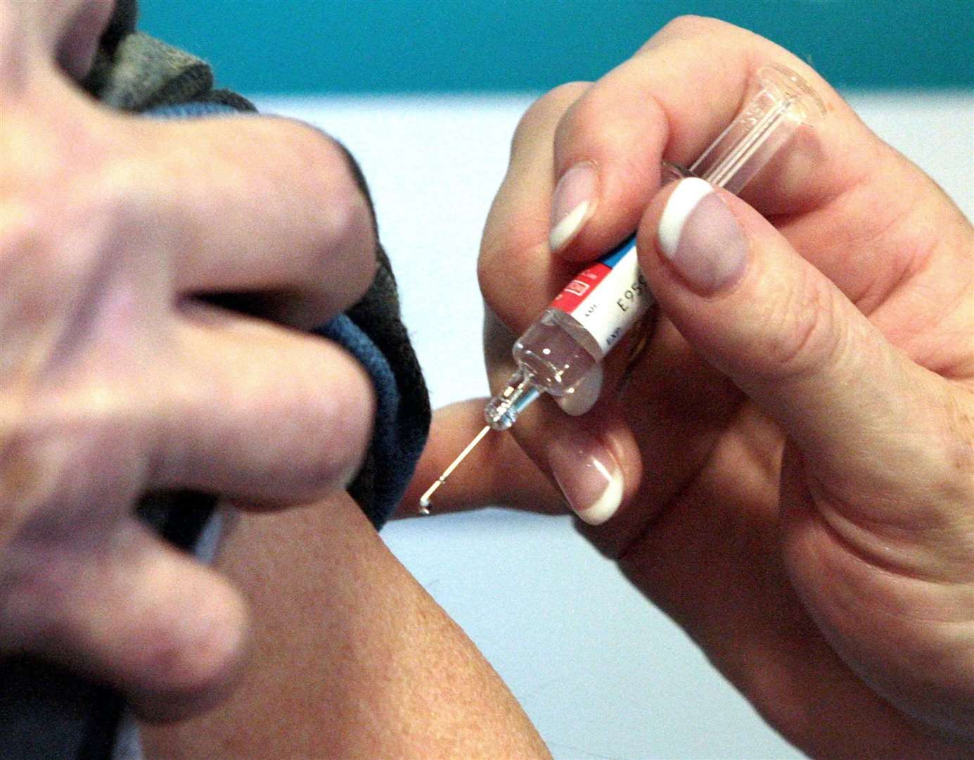 A Covid-19 vaccination developed by Pfizer has been approved and will be rolled out in GP surgeries from next week. Picture: PA