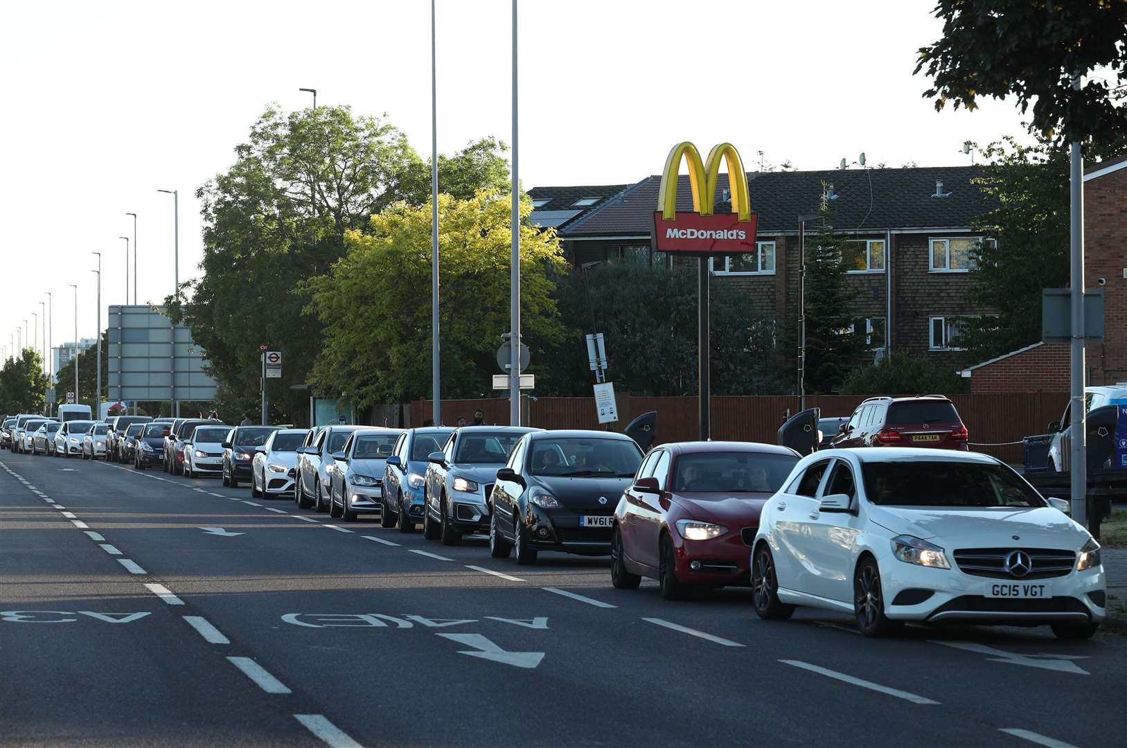 Cars queue at the McDonald’s drive-thru in Hounslow (Yui Mok/PA)