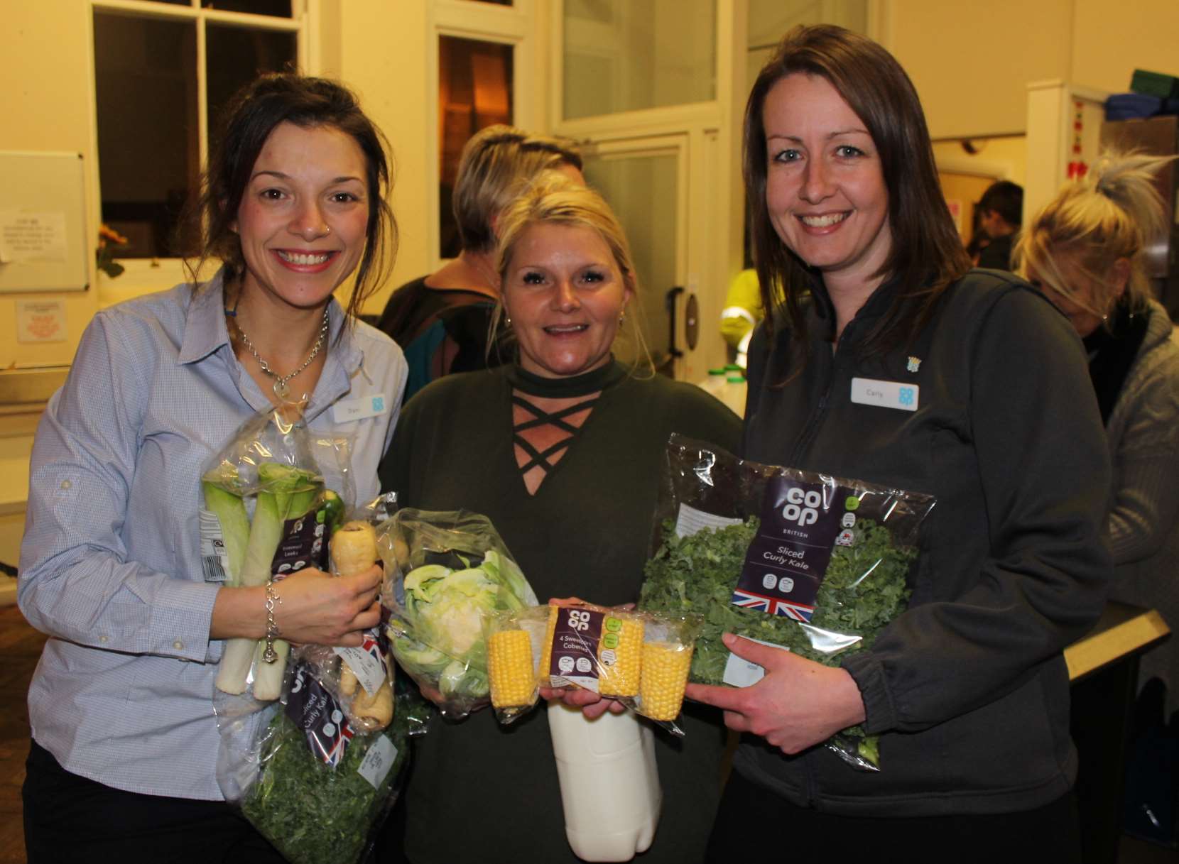 Hand-outs: Coop's Dani Arnone, left, and area manager Carly Muggivan, right, with Castle Connections' manager Suzanne Backshall