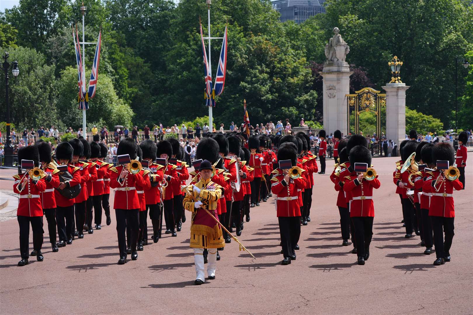 Members of the Band of the Grenadier Guards march outside Buckingham Palace (Jonathan Brady/PA)