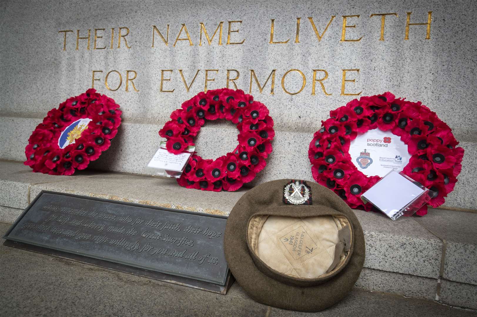 Wreaths and the cap of the late Jack Low, who served with the 51st Highland Division, were laid at the Stone of Remembrance in Edinburgh as part of the commemorations (Jane Barlow/PA)