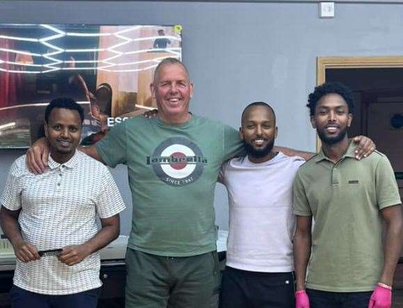 Villager Peter Saward welcomed back Meron (left) and TMC Barber owners Aman Tuku and Samuel Ketema to Teynham