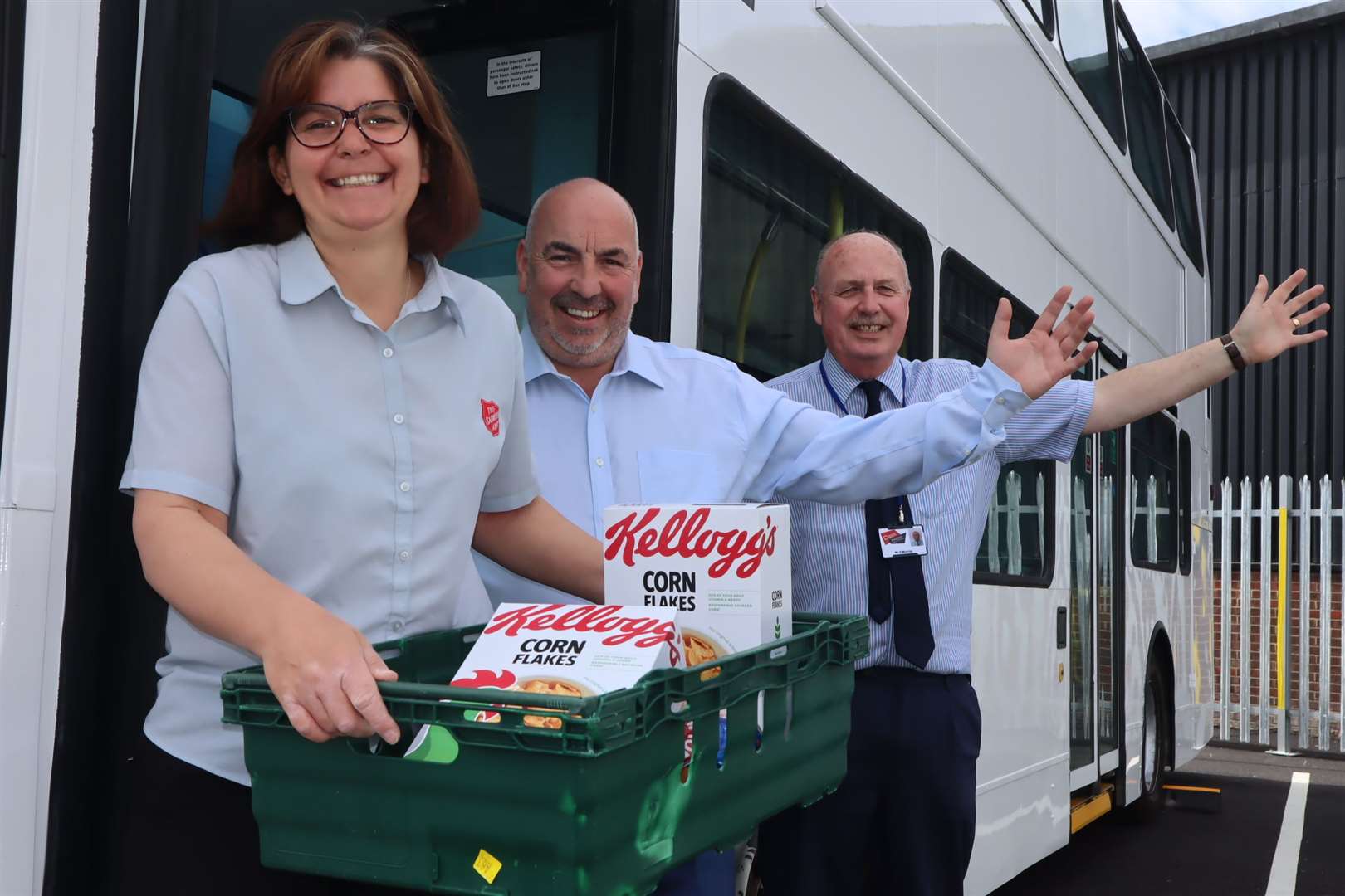 Hold very tight! Major Lynne Clifton of Sheerness Salvation Army is in the driving seat of the Sheppey Community Development Forum's community supermarket bus. It has been donated by Tim Lambkin of Travelmasters, centre. With Paul Murray, community leader of the Oasis Isle of Sheppey Academy. Picture: John Nurden