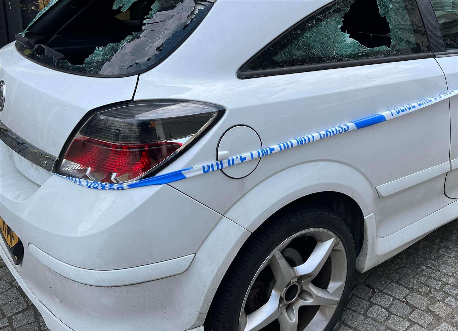 The white Vauxhall Astra was targeted in Folkestone town centre