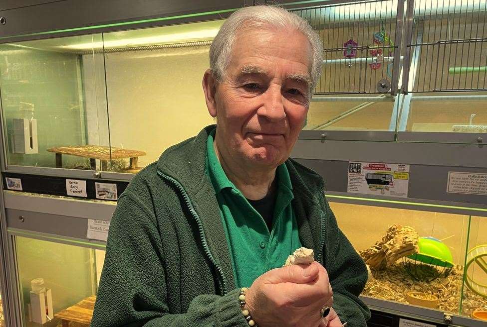 The Pet Shop owner, Victor Brobyn, with his favourite animal he sells a bearded lizard