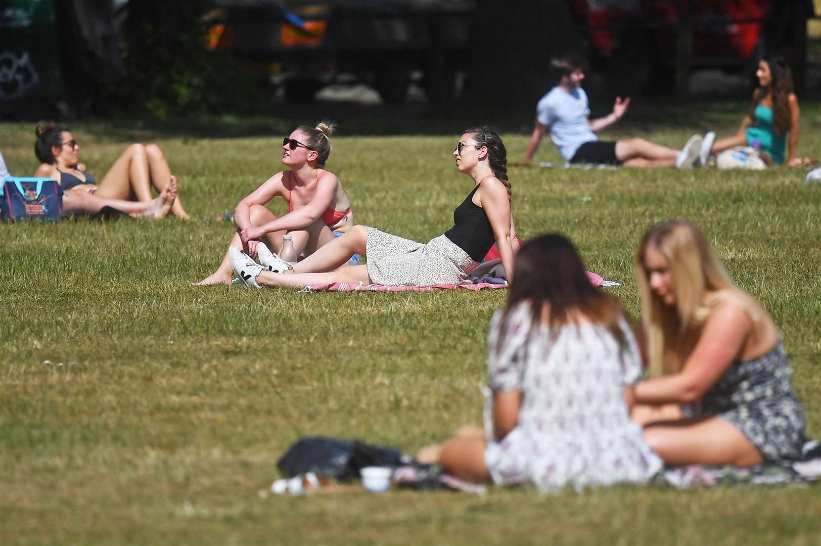 People enjoy the hot weather on London’s Clapham Common (Victoria Jones/PA)