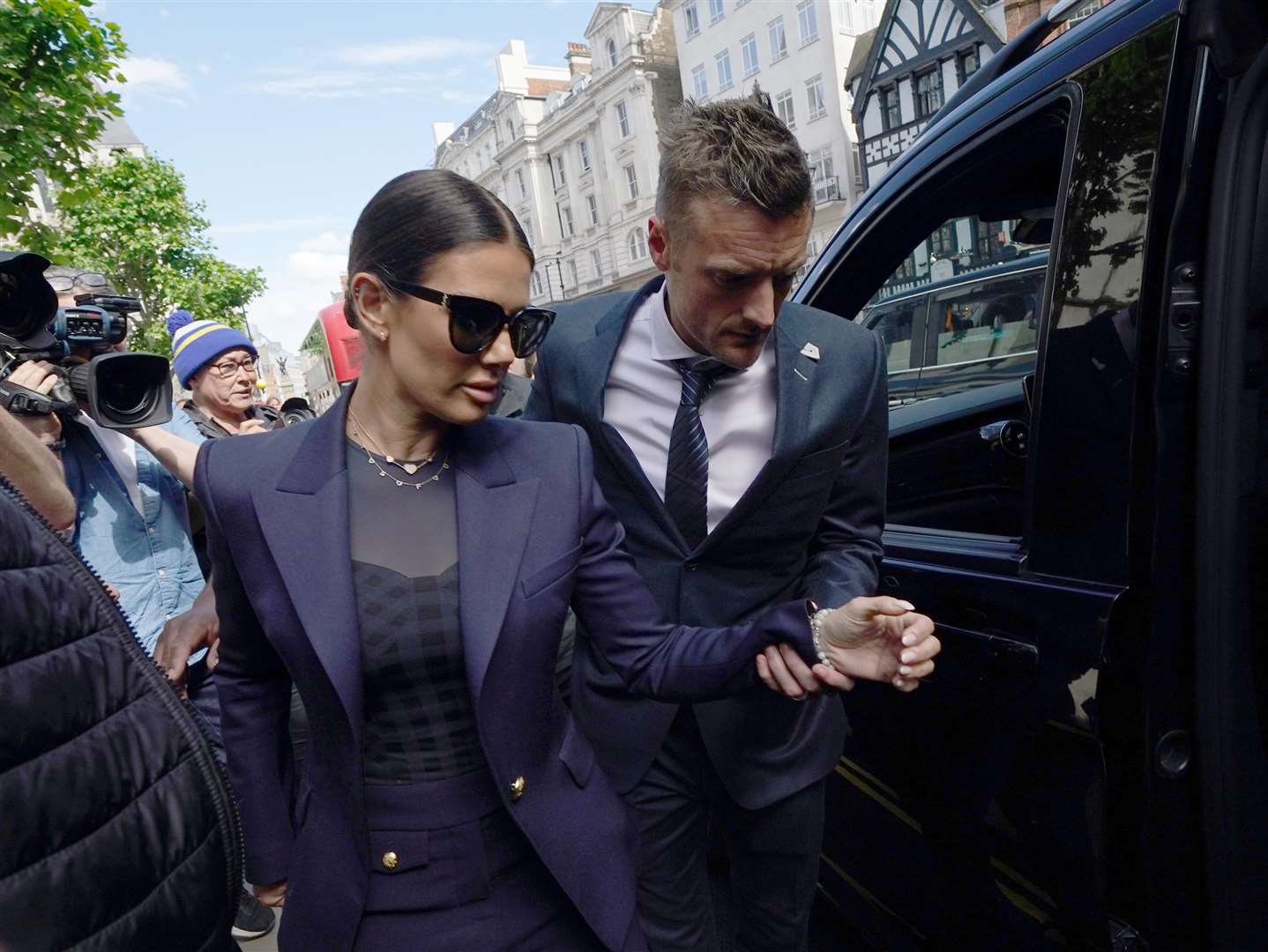 Rebekah and Jamie Vardy outside court (Yui Mok/PA)