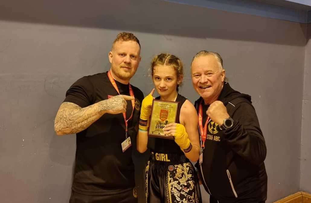 Millie Greenfield, 11, alongside Star Boxing and Kickboxing Academy coaches Leigh and Paul Haworth