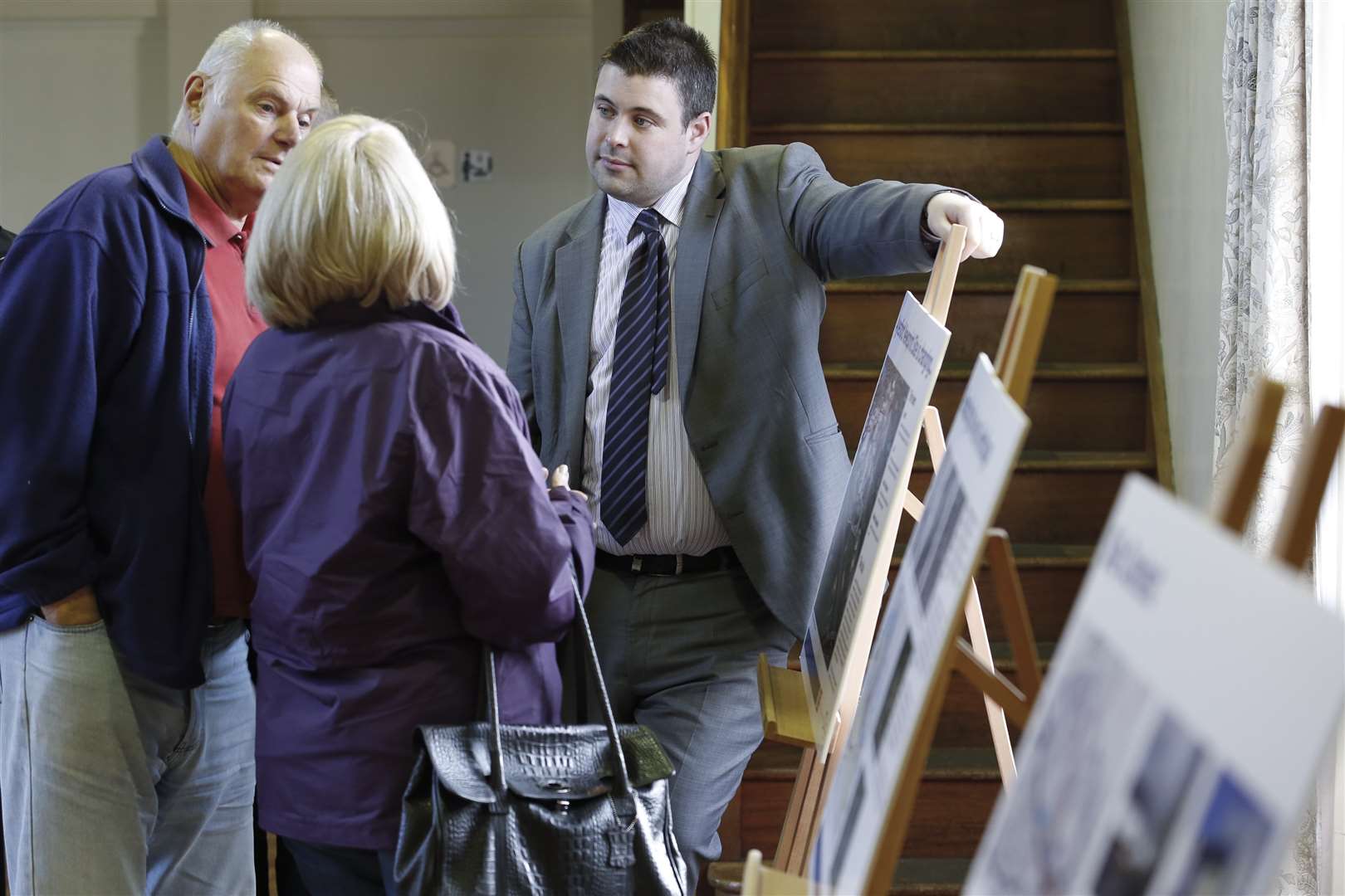 Matthew Black, a senior planner from LSH, talks to visitors about the exhibition