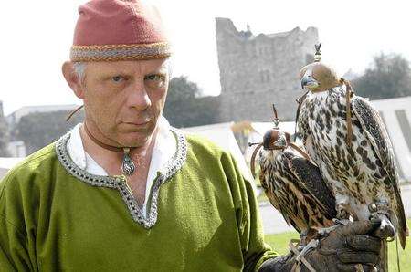 Falconer Gary Baxter with a Lanner Falcon and a Gyr Falcon