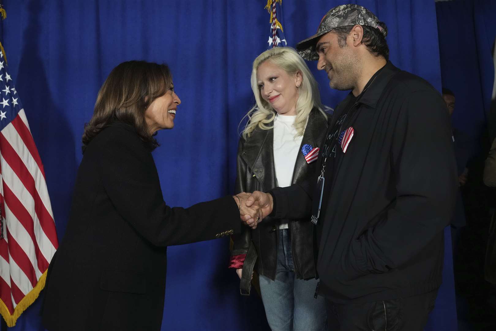 Democratic presidential nominee Vice President Kamala Harris, from left, greets Lady Gaga and her husband Michael Polansky at a campaign rally outside the Philadelphia Museum of Art, Monday in Philadelphia (Jacquelyn Martin/AP)