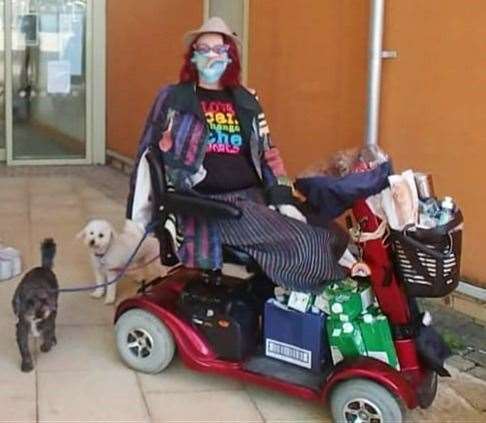 Laura Cordell delivering food bank parcels on her mobility scooter