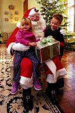 Santa hands out pressies in his gorgeious grotto at Leeds Castle, a miniature of the grand building