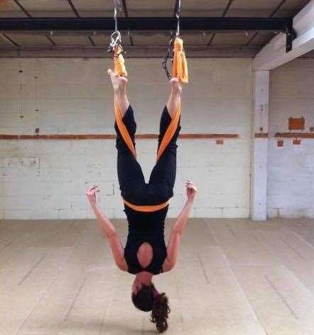Aerial yoga uses a sling or hammock, to achieve poses with more ease. Picture: Jane Salida