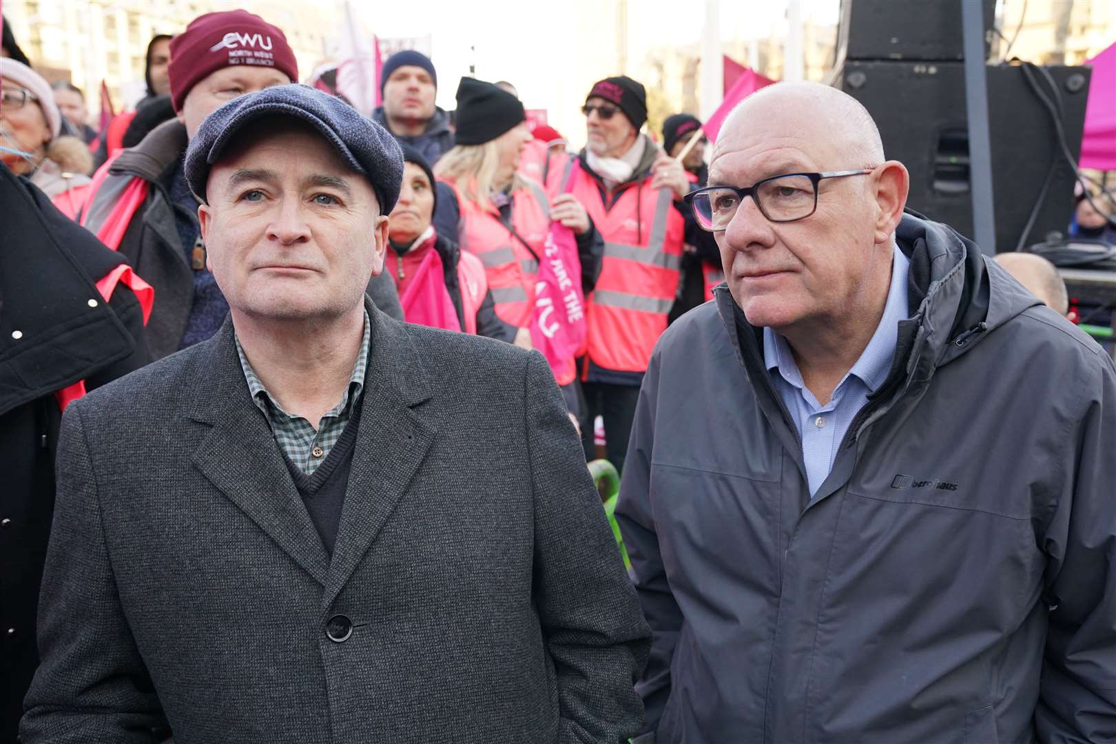 Mick Lynch, general secretary of the Rail, Maritime and Transport union, joins Dave Ward, general secretary of the Communication Workers Union, during a rally in Parliament Square (Jonathan Brady/PA)