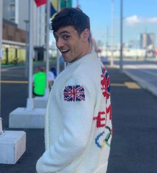 British diving gold medallist Tom Daley wears his Olympic-themed cardigan (@madewithlovebytomdaley/PA)