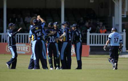 Sam Northeast heads back to the pavilion as the Yorkshire players celebrate