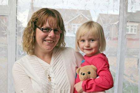 Kelly Collins with daughter Katie, who got a piece of Lego stuck up her nose