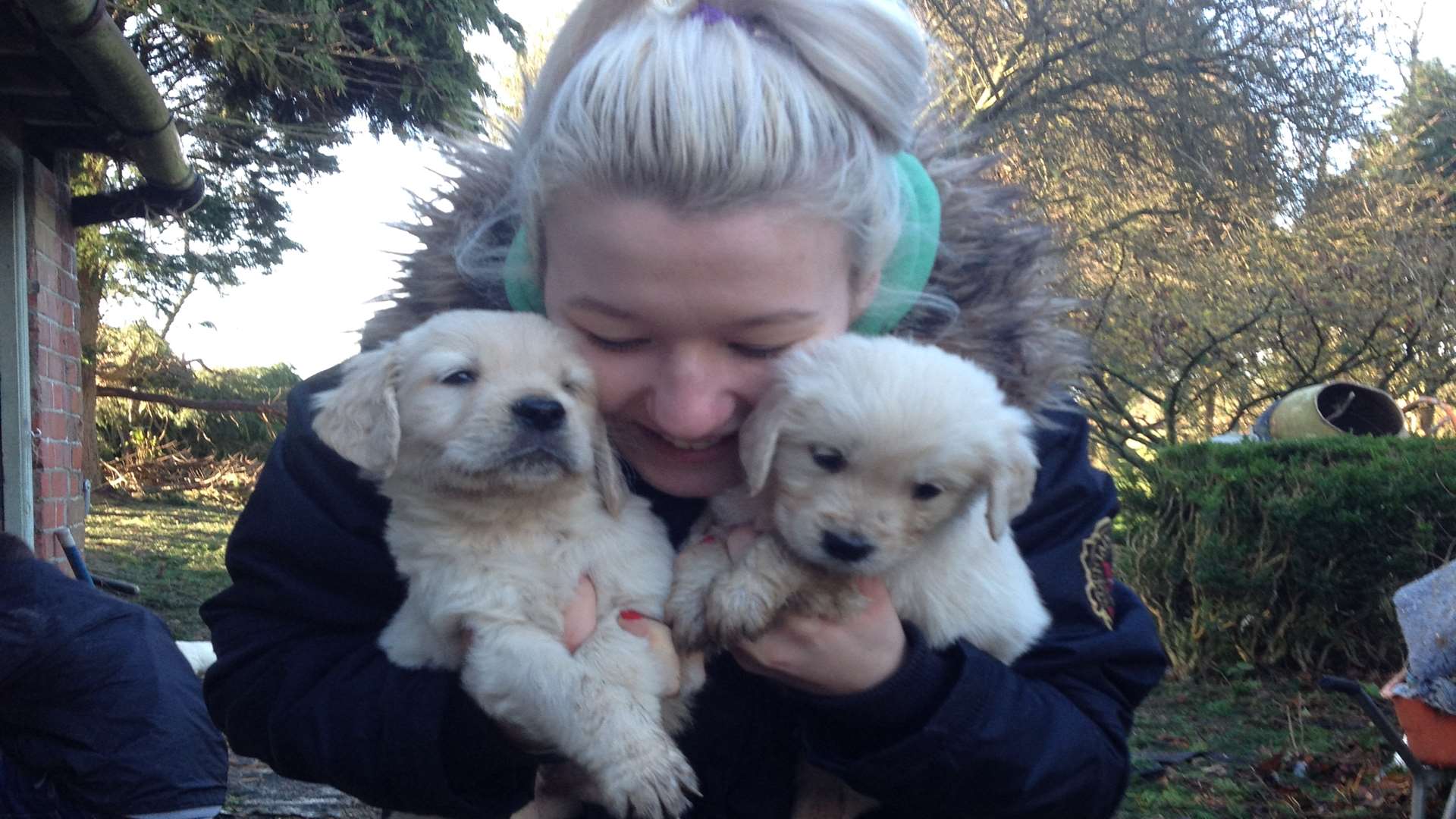 Mrs Kennedy's daughter, Jasmin Spinks, with two of the stolen puppies