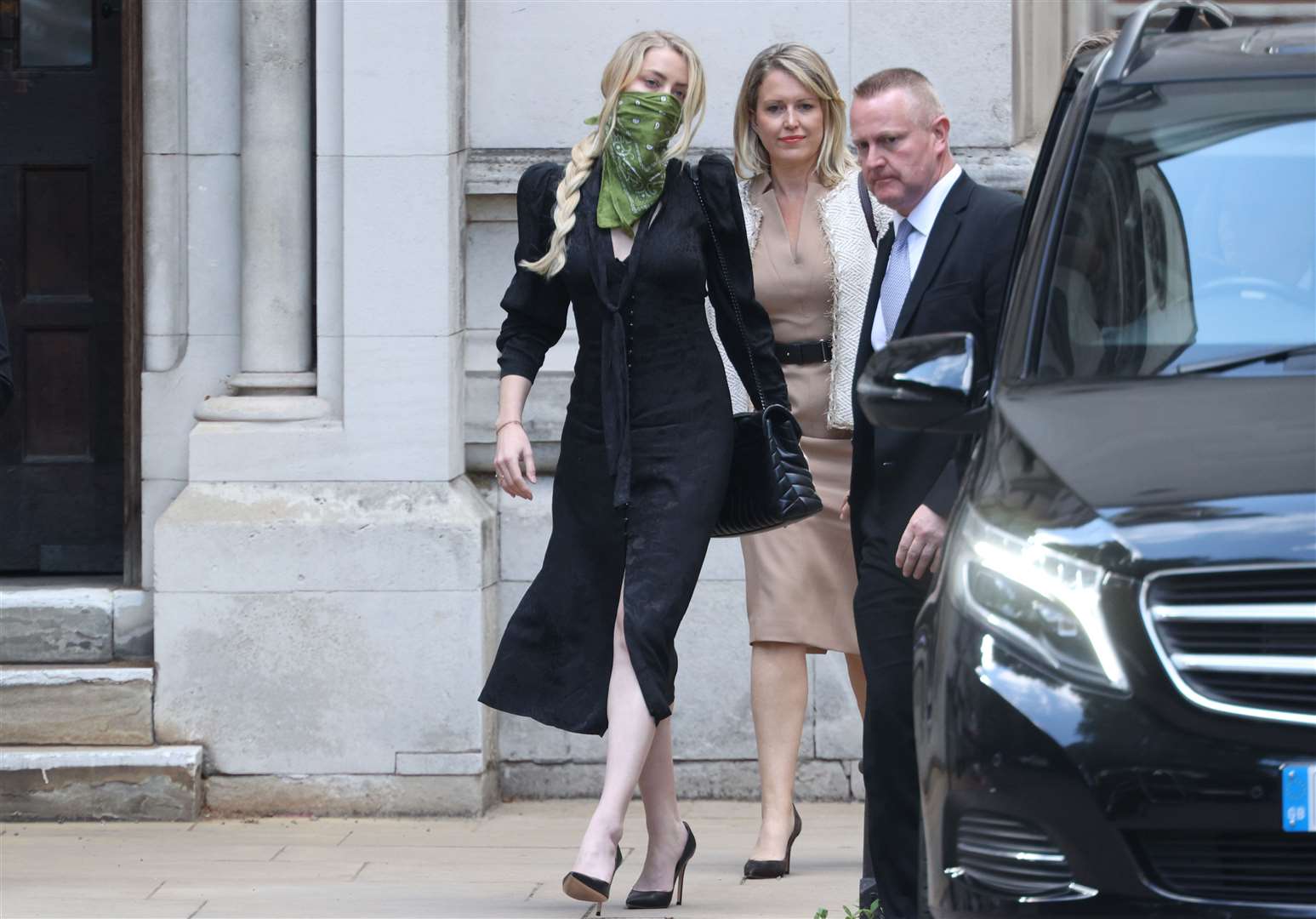 Amber Heard leaving the High Court (Yui Mok/PA)