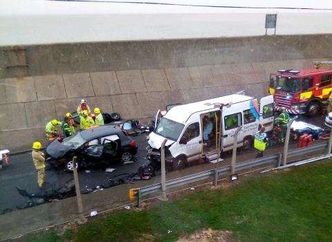 Firefighters remove the roof to cut free a car driver involved in a crash in Marine Parade, Sheerness (6585786)