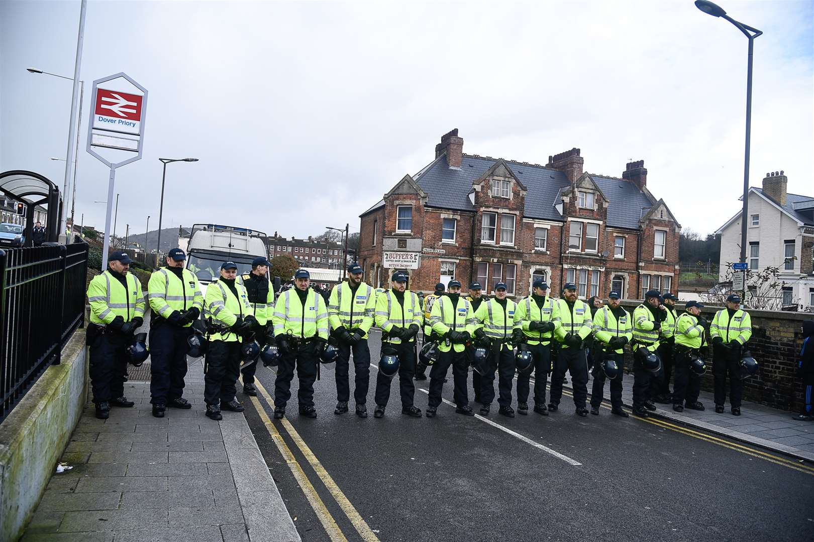 Police form a human barrier at the previous protest