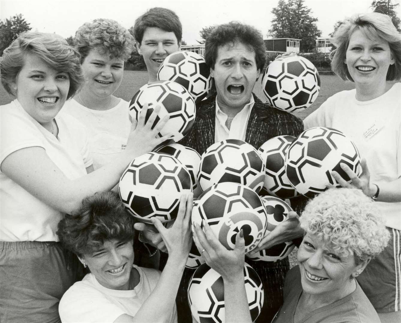 TV presenter, Bill Buckley, with the ladies of East Malling Slimming Club at a charity fun day in June 1988