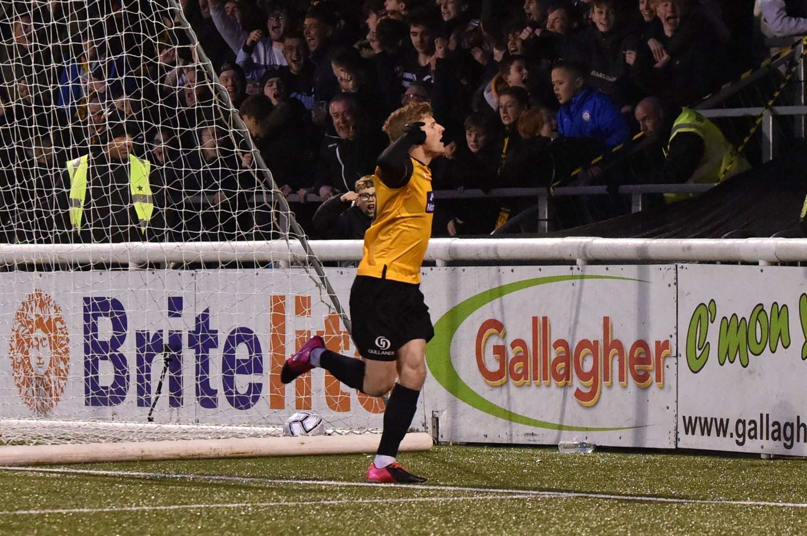 Maidstone hat-trick hero Jack Barham heads for the away fans Steve Terrell