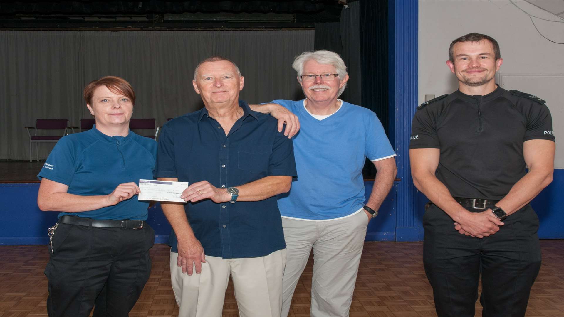 PCSO Jane Wright with hall treasurer Derek Buck, manager Ron Dullage and Sergeant Mark Beresford