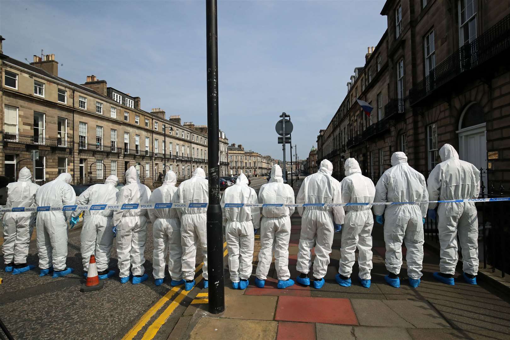 Forensics officers examine the scene where Bradley Welsh was fatally shot in April 2019 (PA)