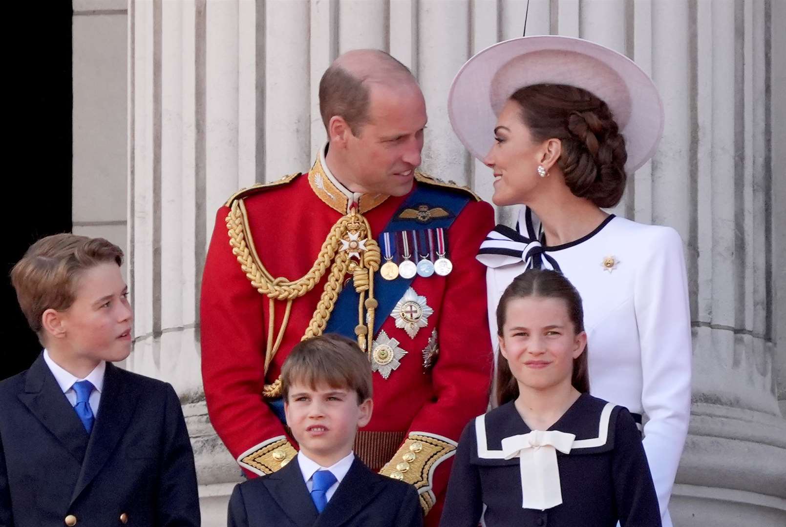 The Prince and Princess of Wales with their children, Prince George, Prince Louis and Princess Charlotte, on the balcony of Buckingham Palace (Gareth Fuller/PA)