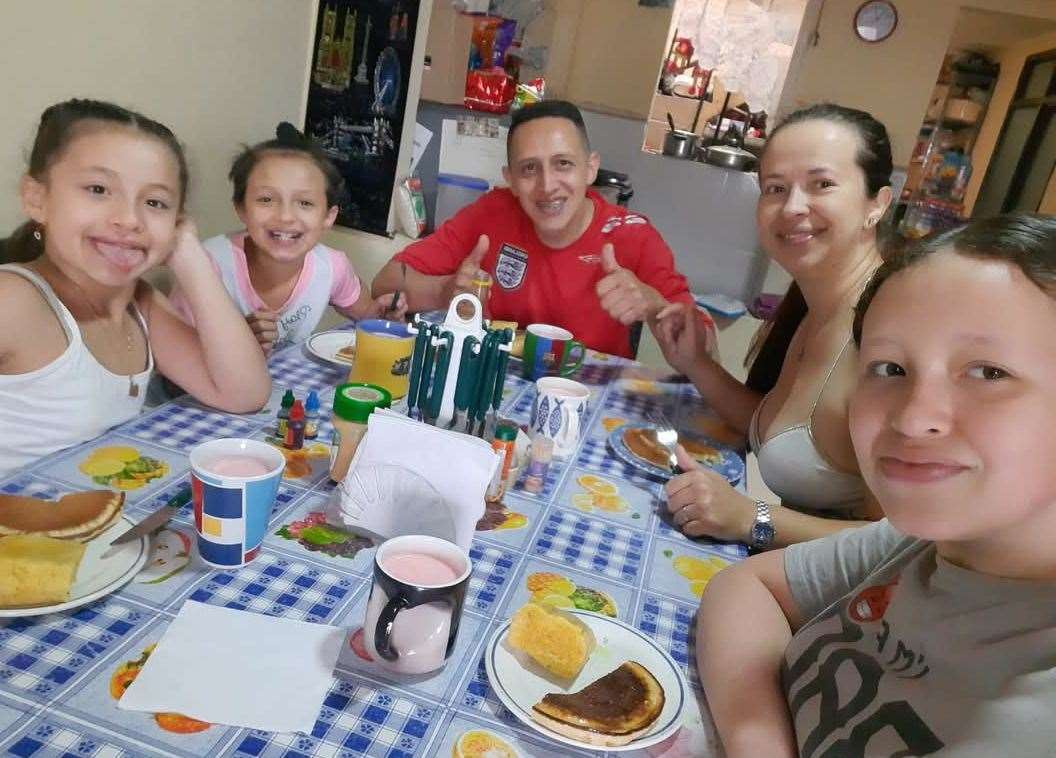 The family enjoying a meal in happier times at their home in Calarcá Quindío, Colombia