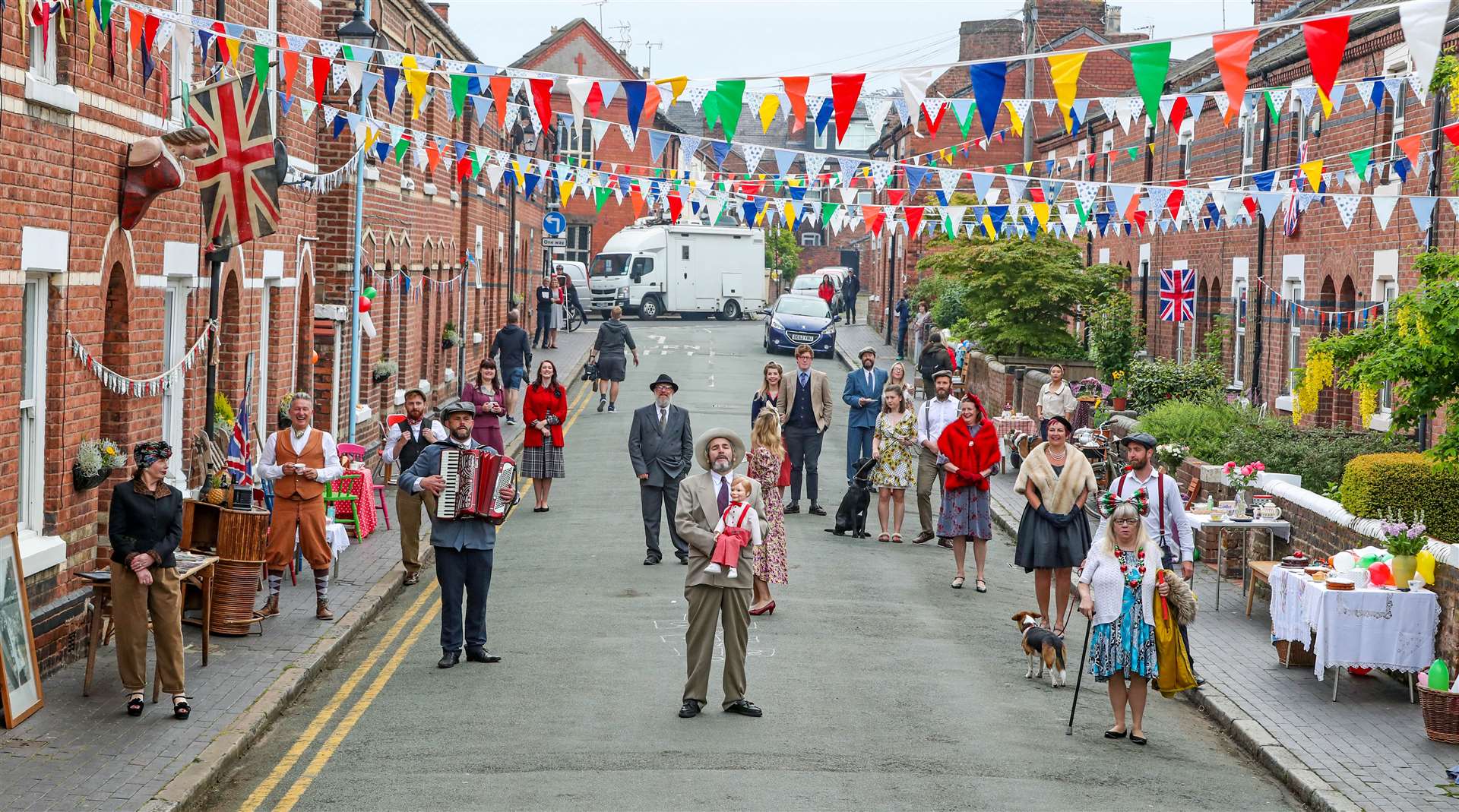 The residents of Cambrian Road in Chester dress up in 1945 clothing and have a social distancing tea party (Peter Byrne/PA)