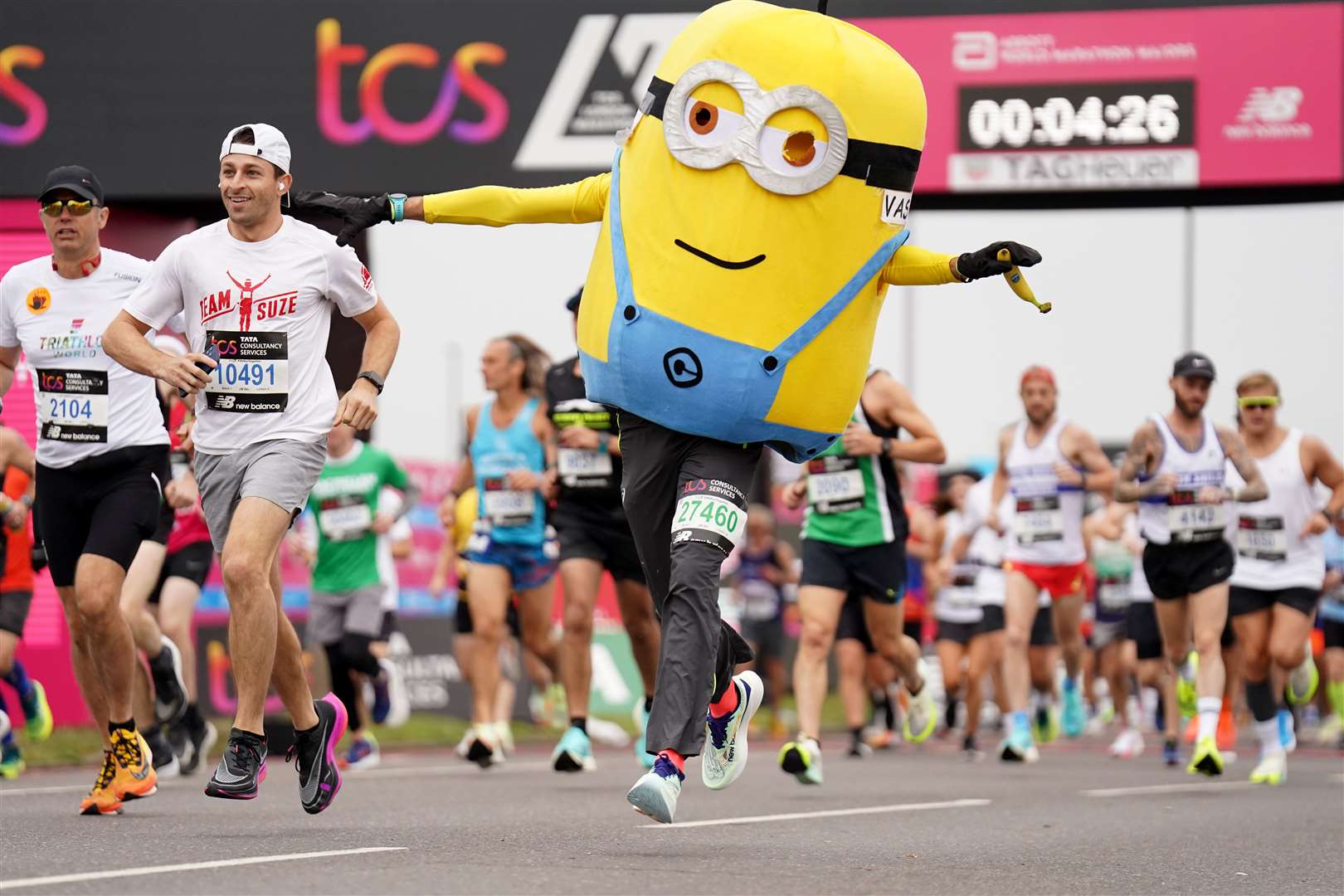 Runners in fancy dress (James Manning/PA)