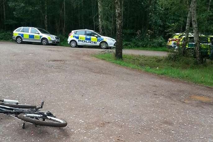 Police and ambulance cars at Clowes Wood, Whitstable after Mr Collett's body was found