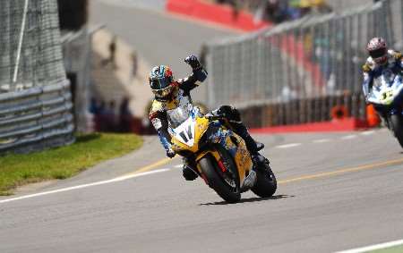 Troy Corser celebrates winning the first race at the weekend. Picture: BARRY GOODWIN