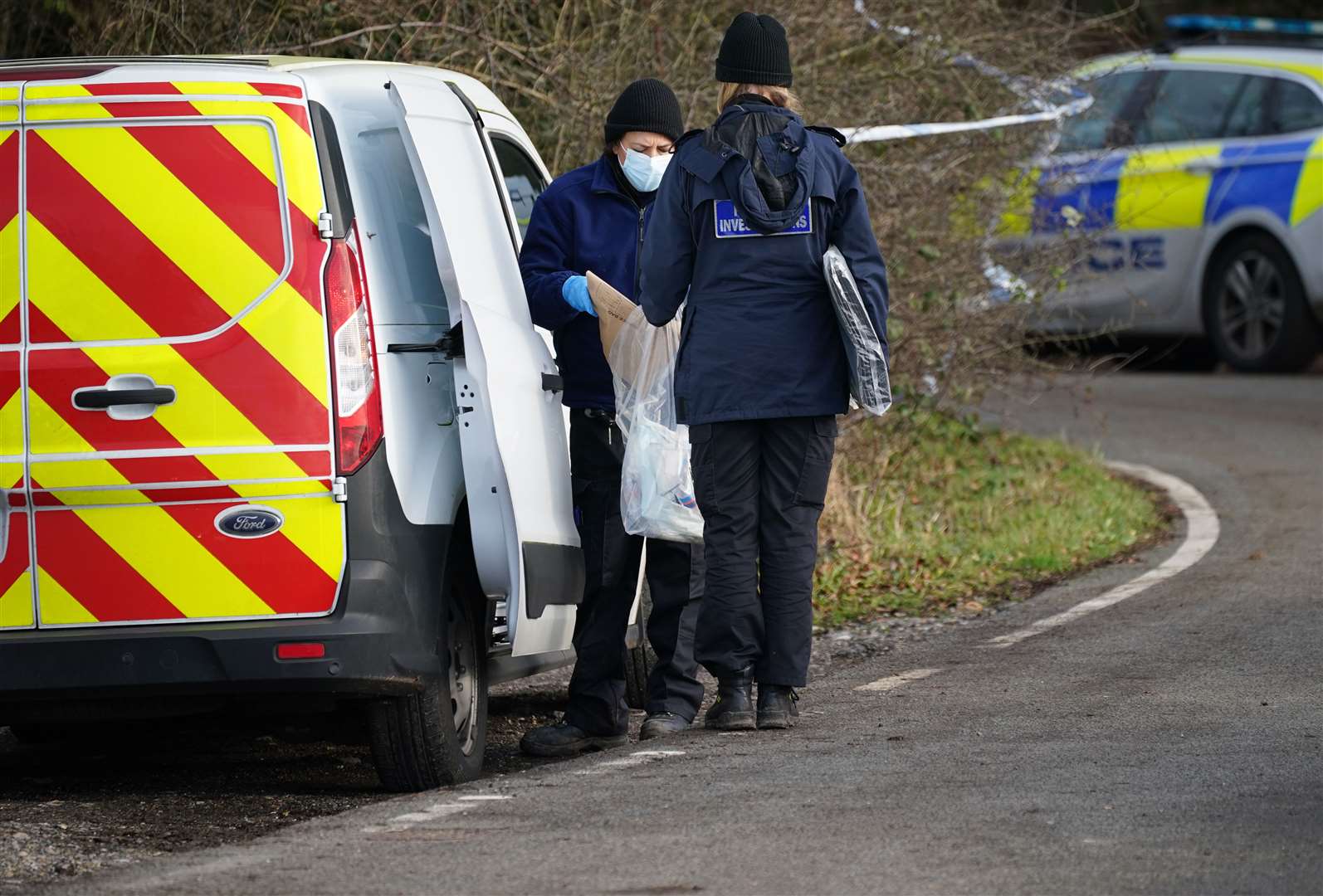 Police at Gravelly Hill in Caterham, Surrey (Yui Mok/PA)