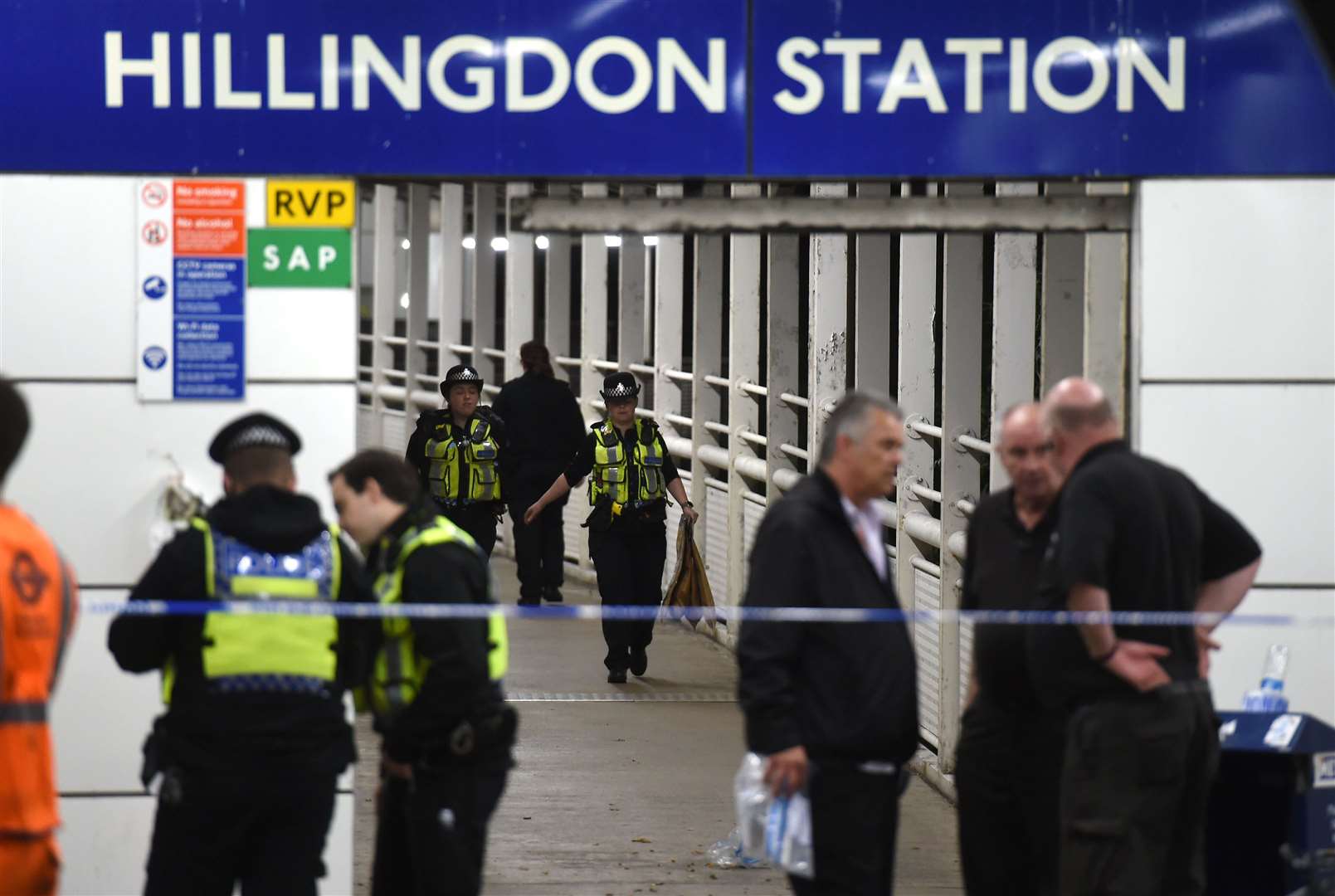 Police outside Hillingdon underground station (PA)