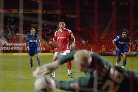 SPOT ON: Zheng Zhi beats keeper Conrad Logan with his penalty. Picture: BARRY GOODWIN