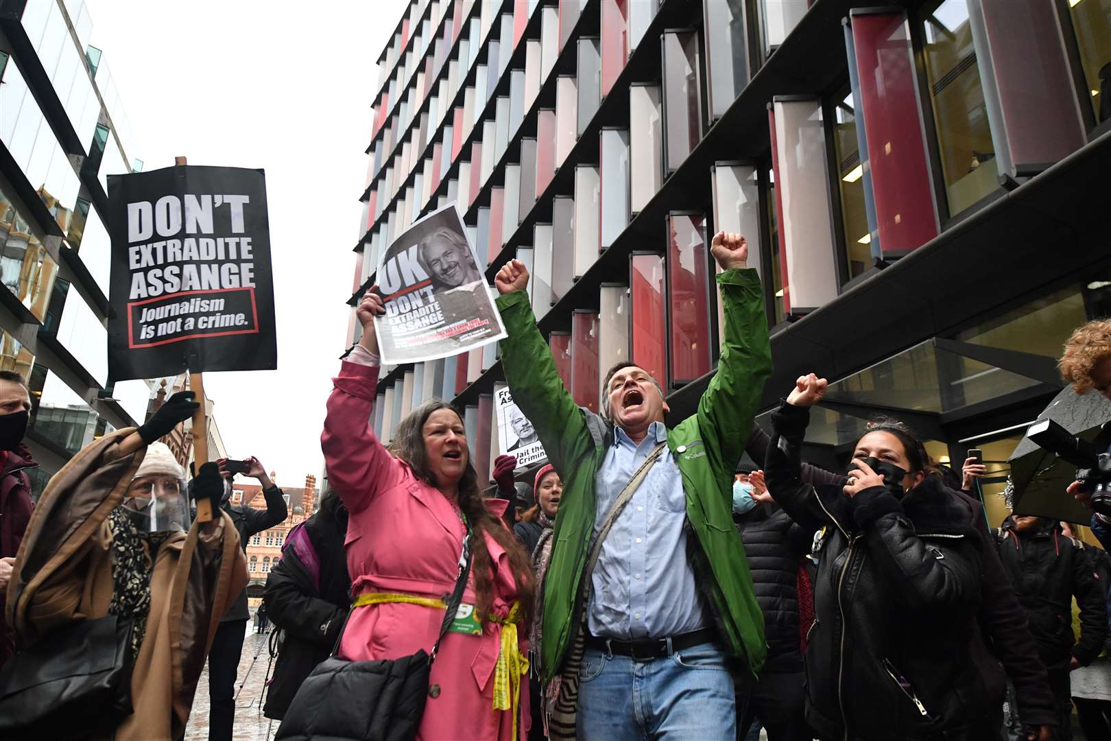 Supporters of WikiLleaks founder Julian Assange celebrate outside the Old Bailey following the ruling that he cannot be extradited to the US (Dominic Lipinski/PA)