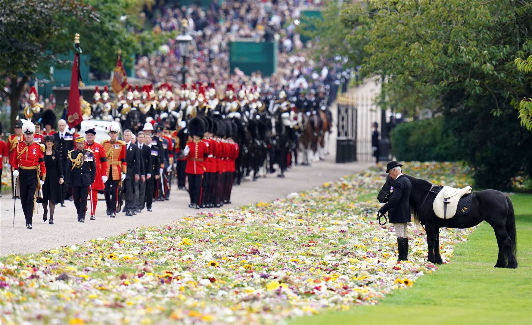 Emma, the monarch’s Fell Pony, stands as the ceremonial procession of the Queen’s coffin arrived at Windsor Castle (Andrew Matthews/PA)